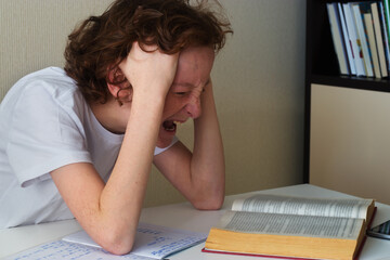 teen screams while doing homework
