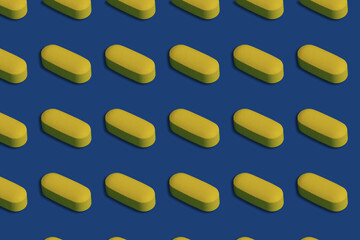 Yellow pills seamless pattern on blue background.	