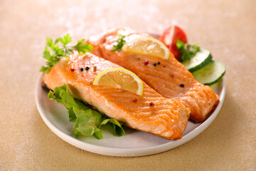 grilled salmon and lettuce in plate