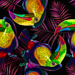 Colorful toucan birds and palm leaves seamless pattern. Embroidery art. Ramphastos sulfuratus. Jungle paradise background. Fashionable template for design of clothes, textiles