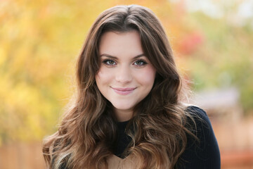 Close up Portrait of 18 Years Old Beautiful, Gorgeous Girl with Long Brown hair and Big eyes, Blurry Fall Background, Happy Teenager 