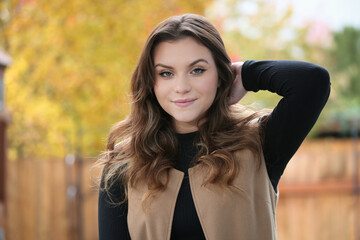 Close up Portrait of 18 Years Old Beautiful, Gorgeous Girl with Long Brown hair and Big eyes, Blurry Fall Background, Happy Teenager 