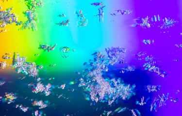 Naklejka na ściany i meble Snowflakes on a rainbow background.