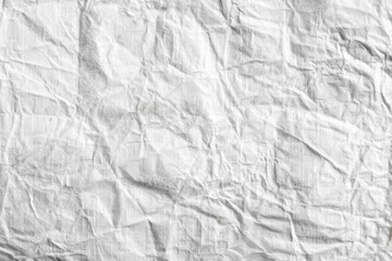 Crumpled white paper as an abstract background.