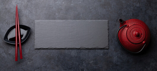 Stone plate and chopsticks for your sushi and maki © evgeeenius