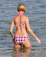 Obraz premium Girl in a swimsuit on the beach.