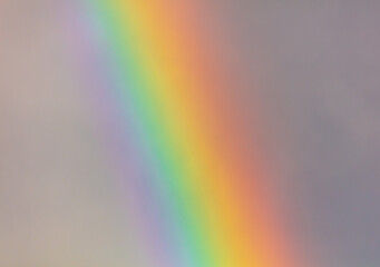 Rainbow in the sky against the background of clouds.