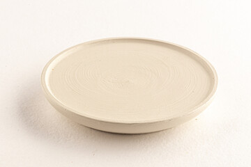 White wooden plate on the white background