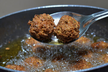 preparing homemade CHINESE fried DRY MANCHURIAN BALLS in vessel
