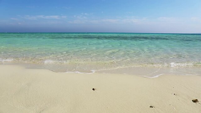 Beautiful landscape with white sandy sea spit beach and warm tropical ocean