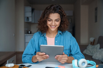 Young woman using computer tablet and working and studying online.