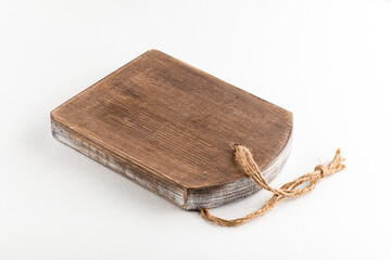 Fototapeta premium Side view on isolated wooden cutting board