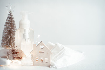 Christmas background with coronavirus personal protective equipment and decor details copy space.