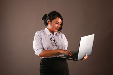 Young woman working on laptop.