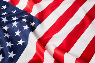 Close up of ruffled American flag. Satin texture curved flag of USA. Memorial Day or 4th of July....