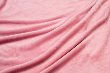 The blanket of furry fleece fabric. A background soft plush fleece material with a lot of relief folds © fizke7
