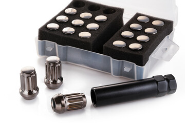 a set of gray shiny nuts for alloy wheels and auto tuning on a white background isolate