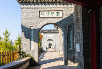 Archway to ancient Ganlu Temple on Beigu Mountain, Zhenjiang, Jiagnsu, China. Built in Three Kingdoms era in 3rd CE. Famous for many historic legends. Tourist attraction.