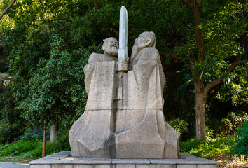 Sculpture of Liu Bei & Sun Quan holding swords together, kings of Shu & Wu states in Three Kingdoms era in 3rd CE, at foot of Beigu Mountain, Zhenjiang, Jiangsu, China.