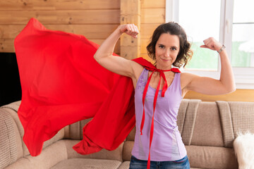 The woman in the hero's red cape shows her strength.