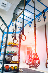 Fitness straps. Traction and suspension training equipment on gym background. Modern equipment for work out. Close-up.