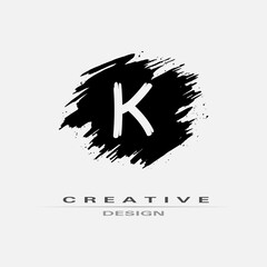 Letter K Logo With Brush Stroke and Splatter Elements. Handwritten Brush Stroke letter K logo design. Creative template suitable for company, logotype, emblem, monogram, jewelry, cosmetic, brand name.