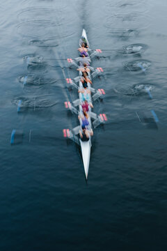 Overhead view of a crew in an eights boat rowing on a lake 