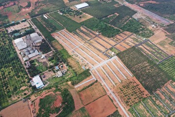 A bird's eye view of plots placed with the beauty of nature. 