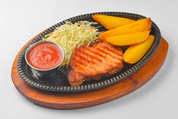 Grilled steak meat with baked potatoes and green salad. Delicious full dinner. Flat lay, top view.