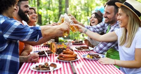 Friends having a barbecue party in nature