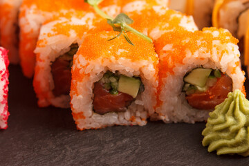 Japanese food: Set of salmon sushi and rolls with salmon and eel