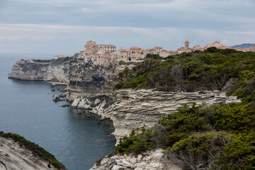 Fototapeta na wymiar The Limestone cliffs coastline of Bonifacio, a commune at the southern tip of the island of Corsica,