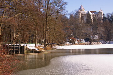 Frozen pond in castle garden and castle Konopiste near Benesov,Central Bohemia,Czech republic,Europe
