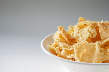 Closeup of a bowl of golden tempting fried yuba