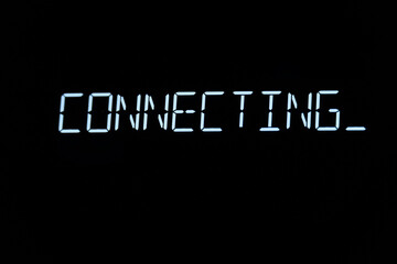 A text message that appears with a deep glow: connect. Luminous text on the computer screen, monitor, or LCD display.