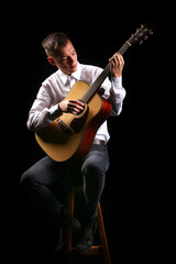 Young men playing the guitar