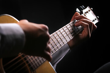 Young men playing the guitar