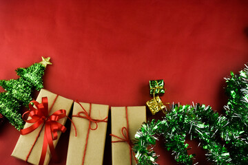 Gift box on red background for Merry Christmas, Brown gift box for happy new yearGift box on red background for Merry Christmas, Brown gift box for happy new year