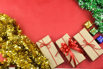 Gift box on red background for Merry Christmas, Brown gift box for happy new yearGift box on red background for Merry Christmas, Brown gift box for happy new year