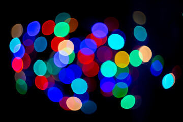  abstract christmas bokeh background with colorful lights on dark background