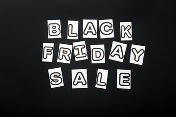 Black Friday sale text lettering on black background. Black and white letters message promotion banner.