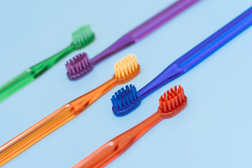 Toothbrushes on blue background. Flat lay. Taking care of teeth, dental concept