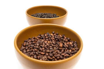 Fototapeta premium Bowls with coffee and dried tea on a white background