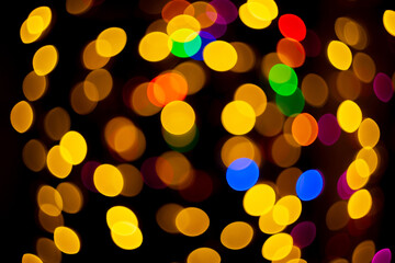  abstract christmas bokeh background with colorful lights on dark background