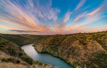 Duero river canyon at sunset with cloudy sky