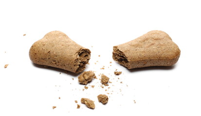 Dog food, brown bone shaped pet treat cracked in half isolated on white background