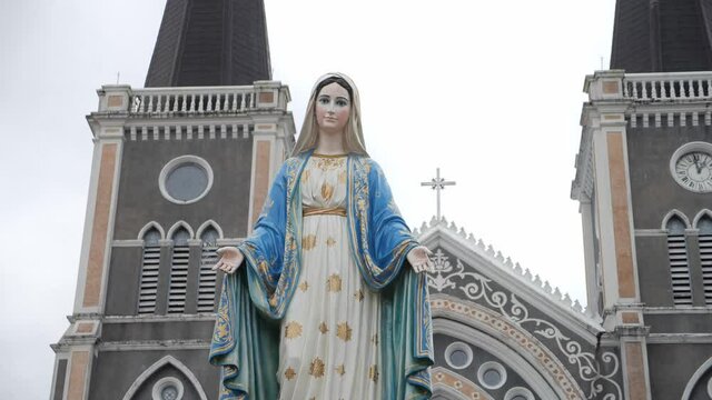 The Blessed Virgin Mary in front of the Roman Catholic Diocese, public place.