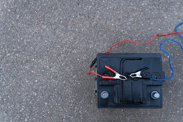 Top view of the battery and clamps from charging, diagnostics and repair of the battery.