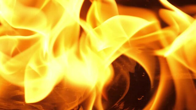 Slow motion speed close up scene on burning matchstick dropping on grunge floor that soak with oil, fast spread of blue hot flame above fuel surface, blasting fire stream pattern ignite on petroleum