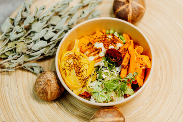 Healthy vegetarian food for a balanced diet rich in vitamins. Organic and regional products. Tofu, carrots and sweet potatoes